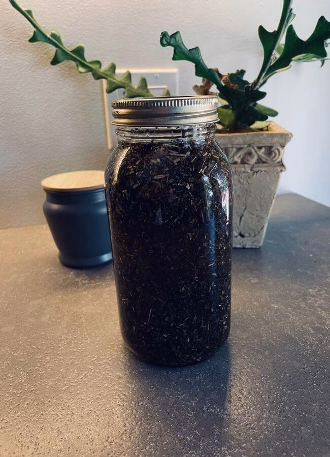Homemade herb-infused Comfrey and Avocado oil ready to use in natural body butters, balms and soap recipes.